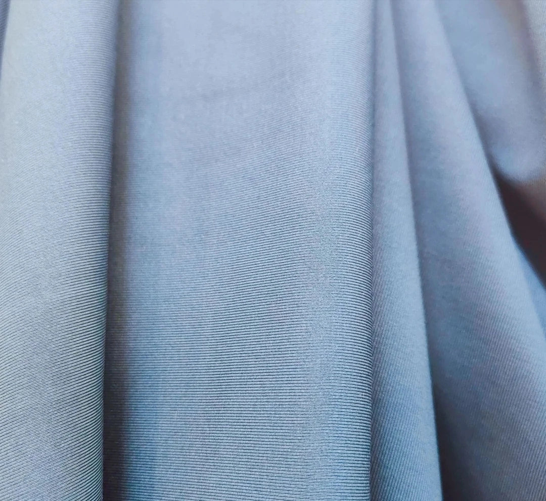 3907 Forro de punto de seda de leche Tela plana Tela de elastano de punto de alta elasticidad Forro de tela de sudor Seda de leche elástica de cuatro lados 8068
