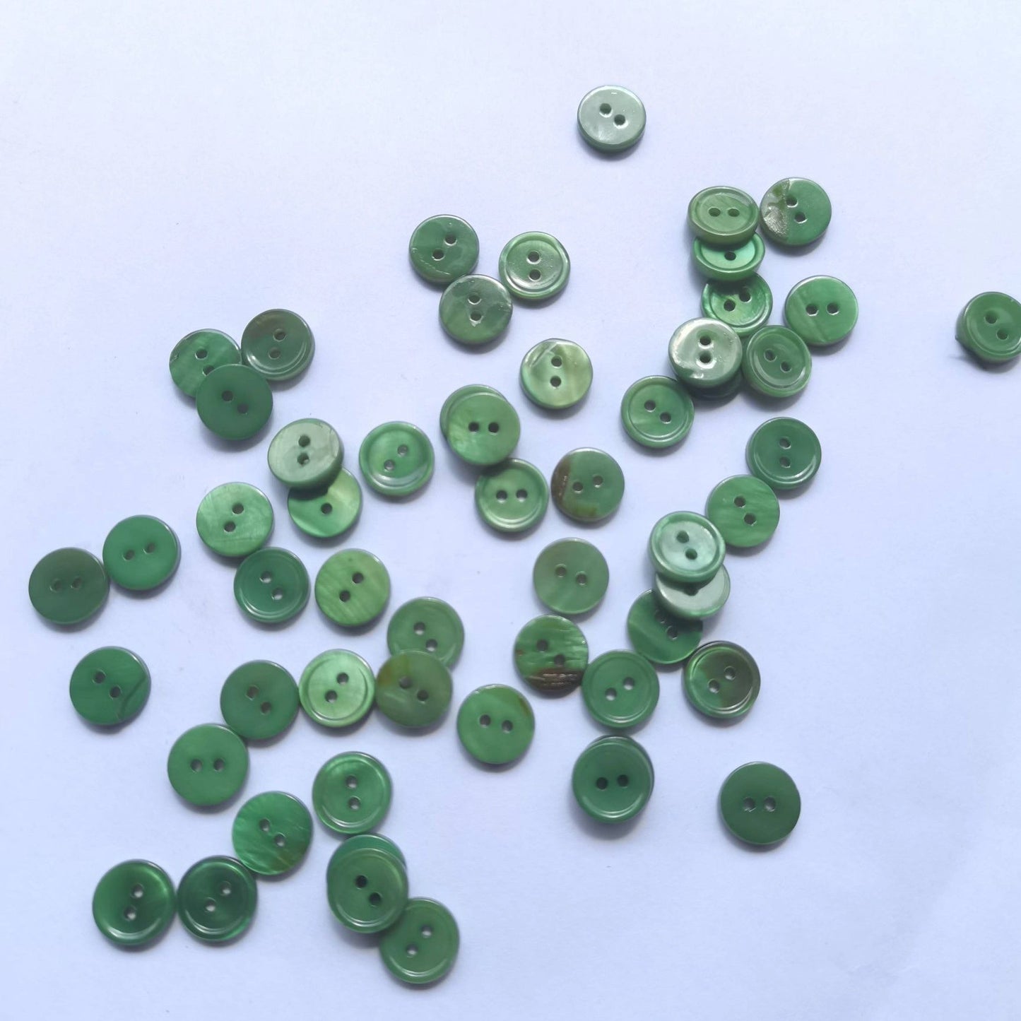 3009  Natural shell material, natural buttons, dyed buttons, spray paint dyed buttons, natural flaws, uneven