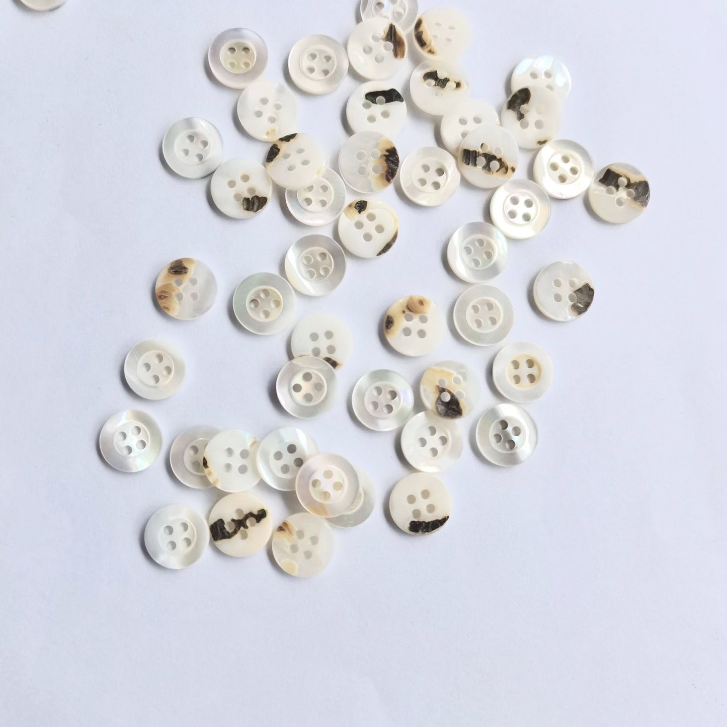 3009  Natural shell material, natural buttons, dyed buttons, spray paint dyed buttons, natural flaws, uneven