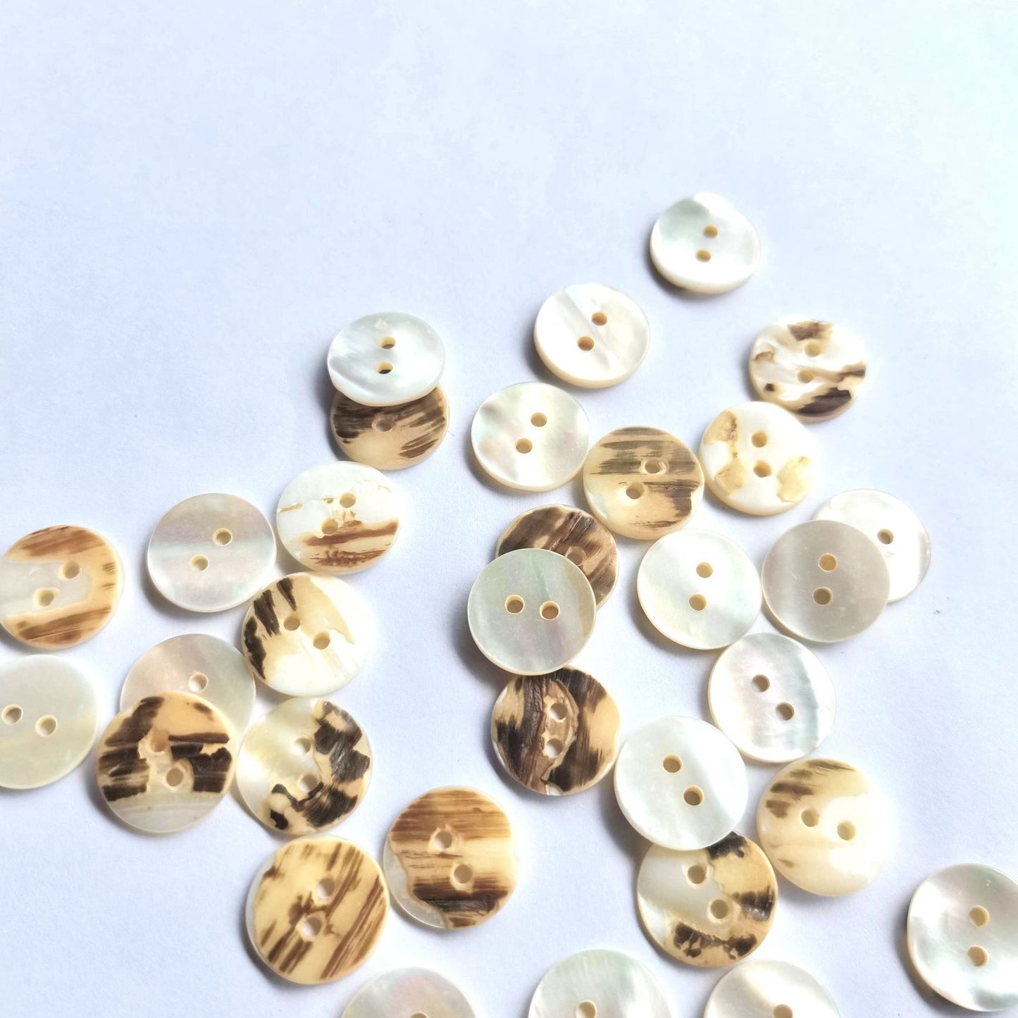 3009  Natural shell material, natural buttons, dyed buttons, spray paint dyed buttons, natural flaws, uneven