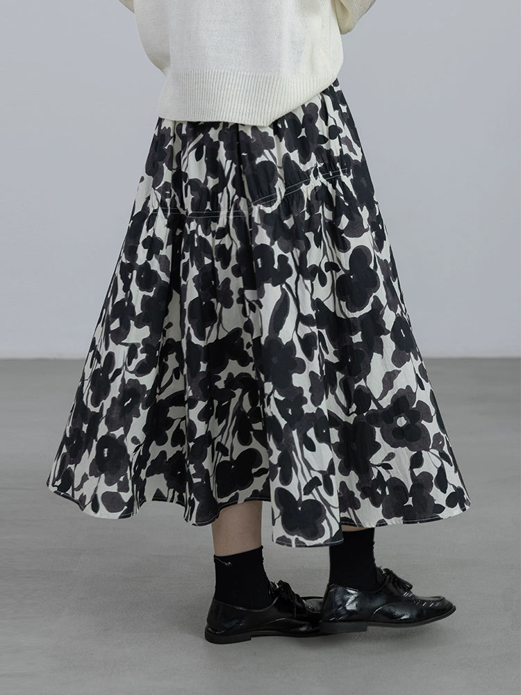 CAREMIND 24SS [refinado] falda floral de otoño para mujer cintura elástica media y larga que cubre la cadera falda en forma de A nueva 