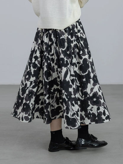 CAREMIND 24SS [refinado] falda floral de otoño para mujer cintura elástica media y larga que cubre la cadera falda en forma de A nueva 