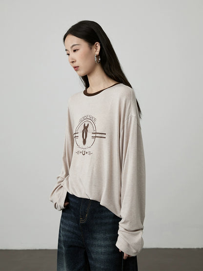 [Camiseta ecuestre] Camiseta con estampado de avena CAREMIND agradable para la piel, holgada, con cuello redondo y manga larga en color contrastante 