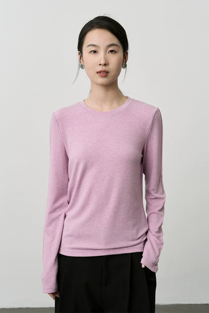 Camiseta de cuello redondo con parte inferior de color rosa suave y ceroso de CAREMIND 2024 Nueva camiseta de manga larga interior premium 