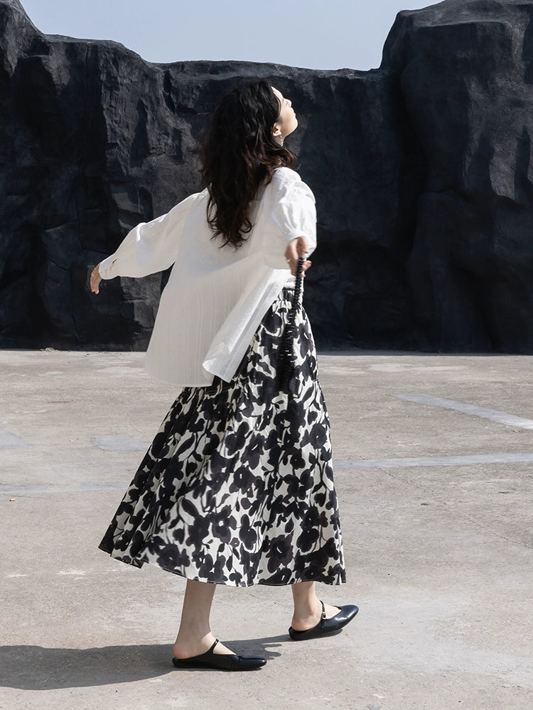 CAREMIND 24SS [refinado] falda floral de otoño para mujer cintura elástica media y larga que cubre la cadera falda en forma de A nueva 