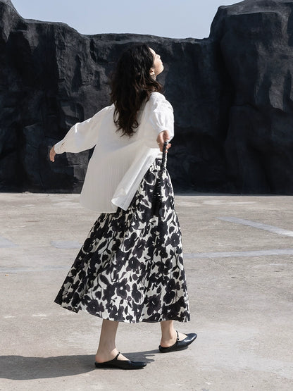 CAREMIND 24SS [refinado] falda floral de otoño para mujer cintura elástica media y larga que cubre la cadera falda en forma de A nueva 