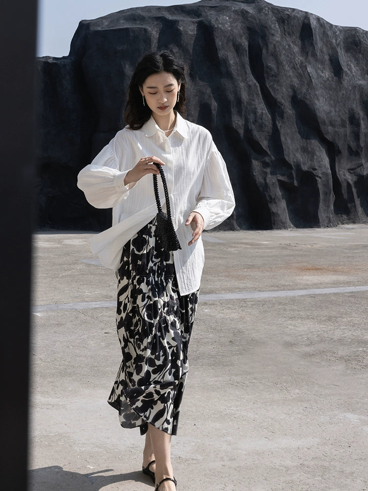 CAREMIND 24SS [refinado] falda floral de otoño para mujer cintura elástica media y larga que cubre la cadera falda en forma de A nueva 