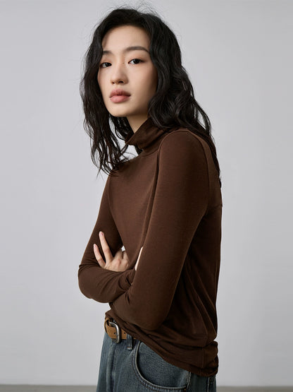 Camiseta de punto con cuello semialto apilado de tencel texturizado de CAREMIND Camiseta de manga larga apilada con cuello alto fino y ajustado 