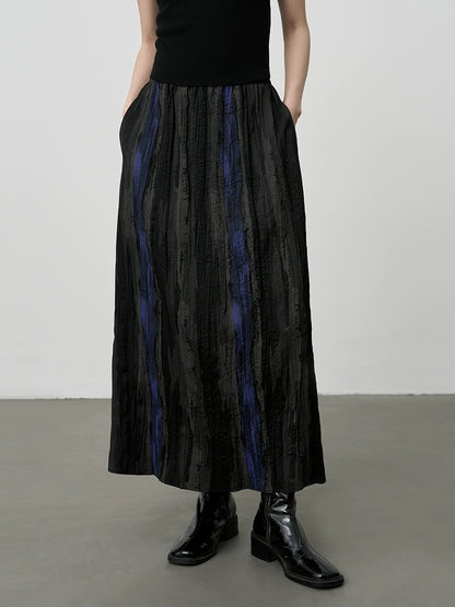 [Esmalte azul] Falda de contraste a rayas con temperamento artístico de CAREMIND, falda larga con pliegues y cintura alta de otoño 