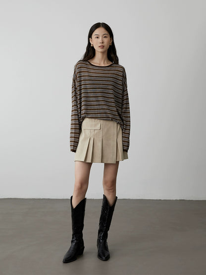 [Pliegues de cuero] Falda corta plisada de gamuza de cintura alta y versátil de CAREMIND, falda de palabra A que cubre la cadera y que parece delgada para hombres pequeños 