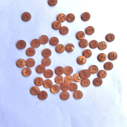 3009  Natural shell material, natural buttons, dyed buttons, spray paint dyed buttons, natural flaws, uneven